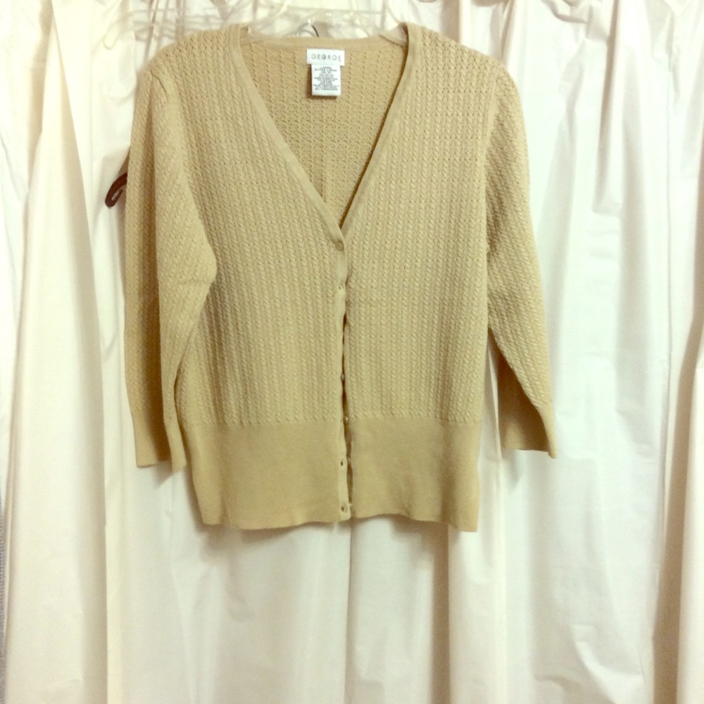 Cable button up sweater. 73% rayon, 23% nylon